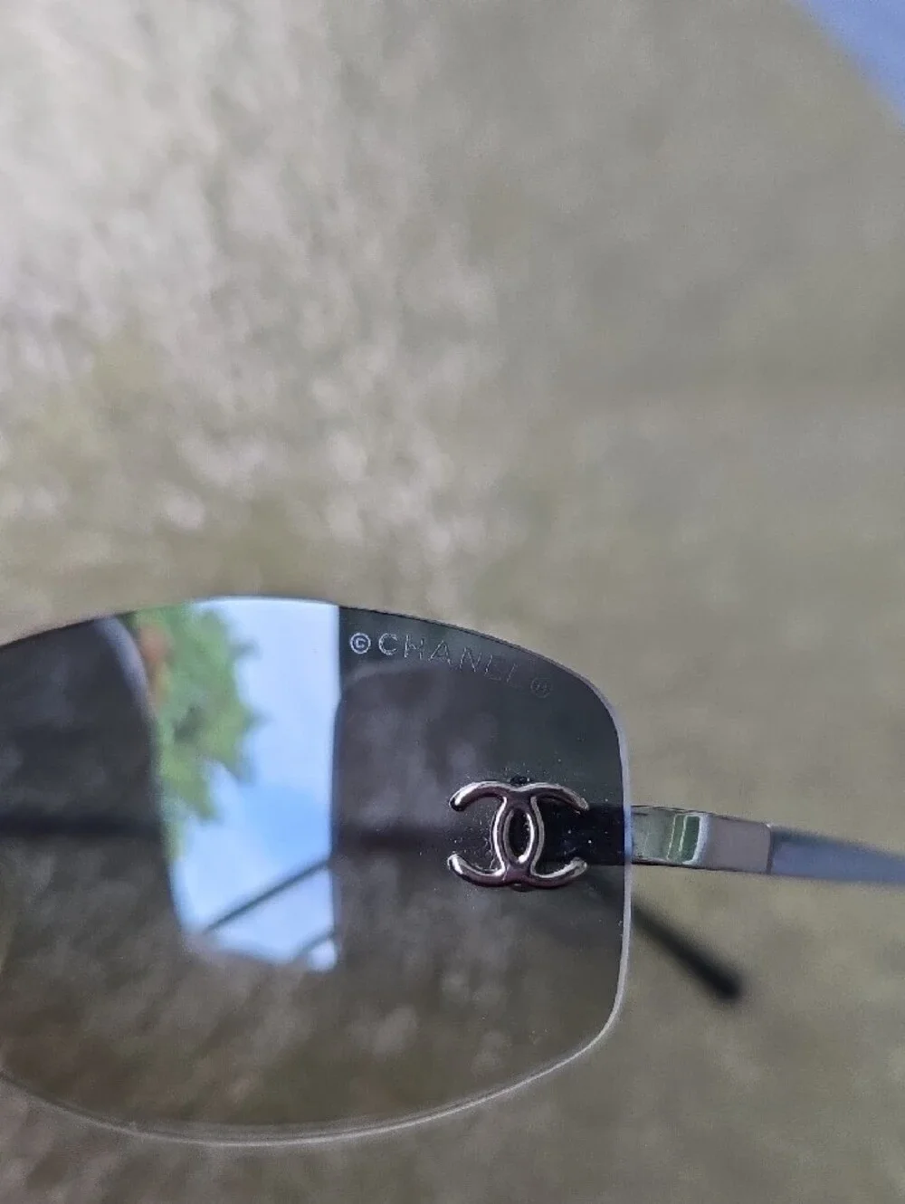 Chanel 4002 Rimless CC Aviator Sunglasses in Smoke Gray.